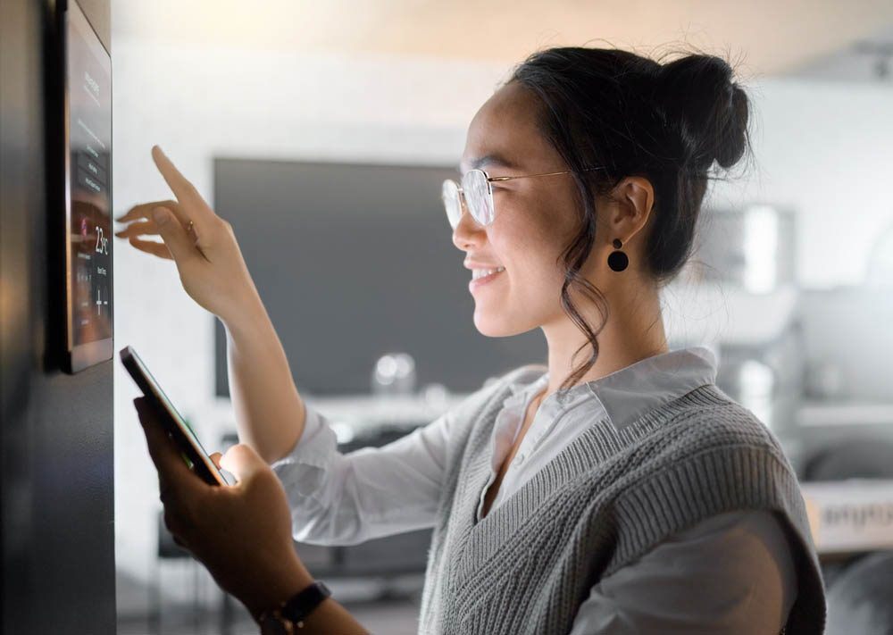 a person adjusting smart home lighting